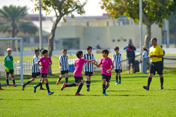 Youth soccer league playing on the field